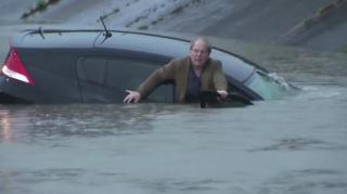 Houston Largely Shut Down Due to Flooding, Reporter Rescues Man on Air
